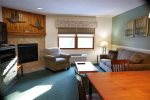 Fireplace and TV at Deer Park vacation rental near Loon Mountain